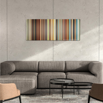 Spirited Away color palette canvas on a concrete wall above a gray sectional sofa