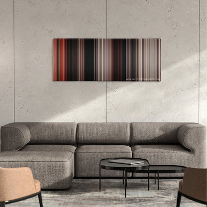 Rambo: First Blood Part II color palette canvas on a concrete wall above a gray sectional sofa