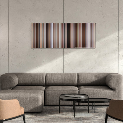 Hitch color palette canvas on a concrete wall above a gray sectional sofa