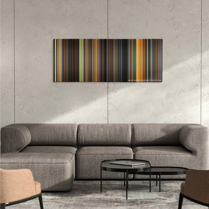 Dune color palette canvas on a concrete wall above a gray sectional sofa