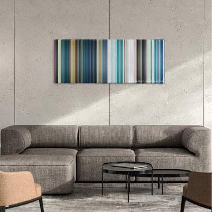 The Meg color palette canvas on a concrete wall above a gray sectional sofa