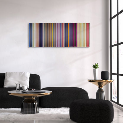 Dumbo color palette canvas above a black sofa with a gold-topped table