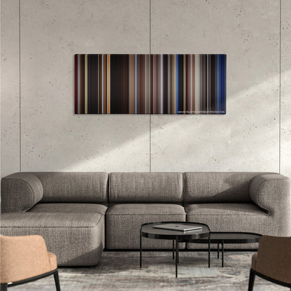 The Notebook color palette canvas on a concrete wall above a gray sectional sofa