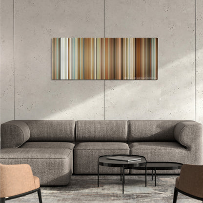 The Holiday color palette canvas on a concrete wall above a gray sectional sofa