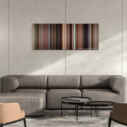 Once color palette canvas on a concrete wall above a gray sectional sofa