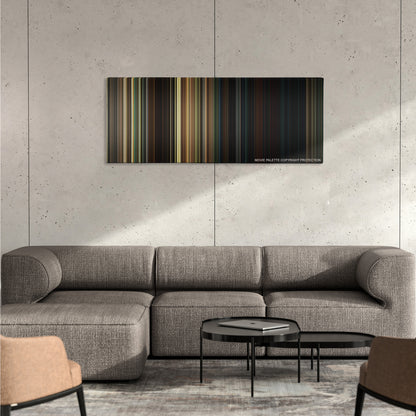 A Quiet Place color palette canvas on a concrete wall above a gray sectional sofa