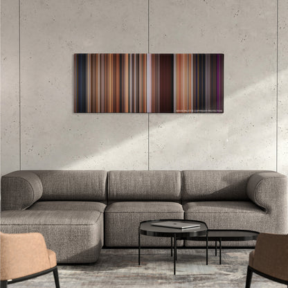 Step Up color palette canvas on a concrete wall above a gray sectional sofa