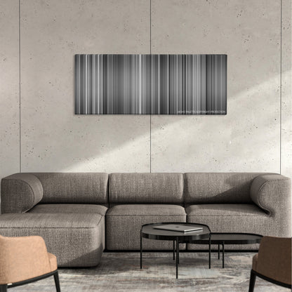 M color palette canvas on a concrete wall above a gray sectional sofa