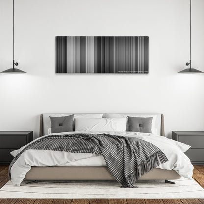 The Third Man color palette canvas above a bed, between two black pendant lamps