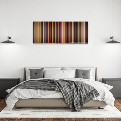 Adventureland color palette canvas above a bed, between two black pendant lamps