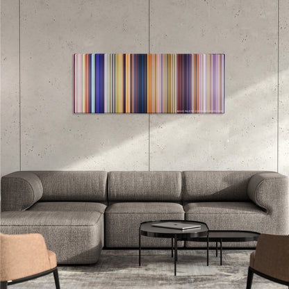 The Lorax color palette canvas on a concrete wall above a gray sectional sofa