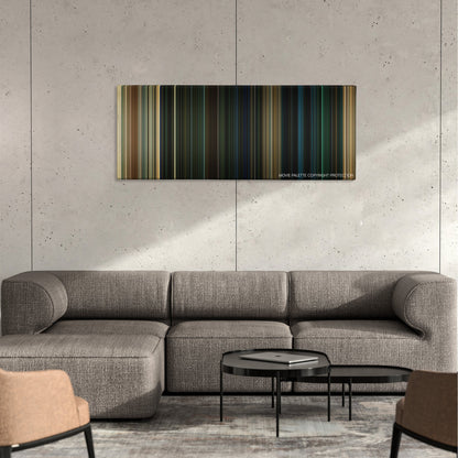 The Purge: Anarchy color palette canvas on a concrete wall above a gray sectional sofa