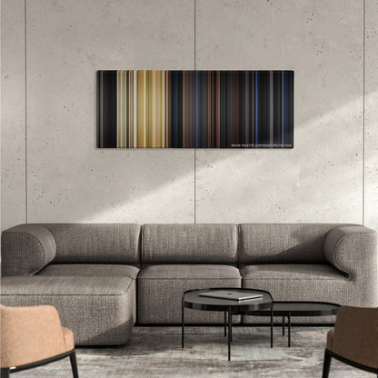Halloween color palette canvas on a concrete wall above a gray sectional sofa