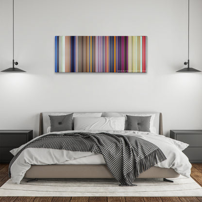 Dumbo color palette canvas above a bed, between two black pendant lamps