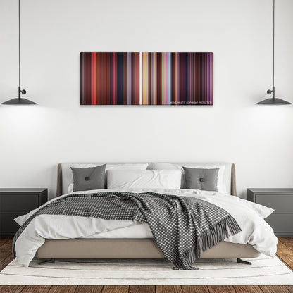 Antz color palette canvas above a bed, between two black pendant lamps