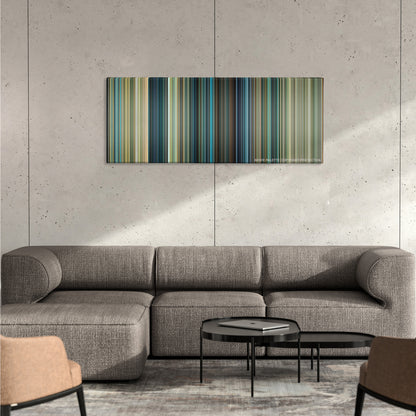 Transformers color palette canvas on a concrete wall above a gray sectional sofa