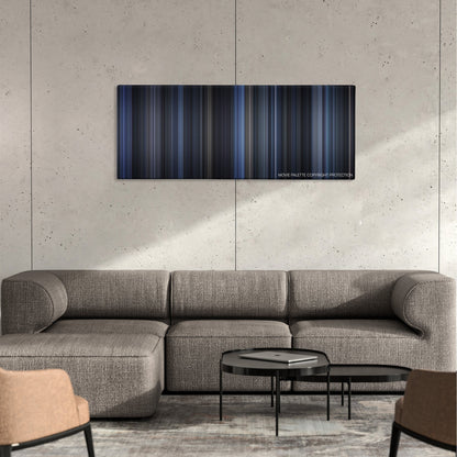 Payback color palette canvas on a concrete wall above a gray sectional sofa