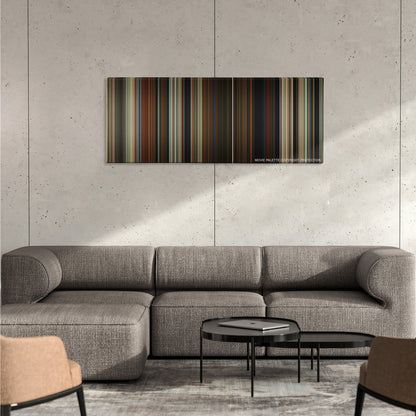 Parasite color palette canvas on a concrete wall above a gray sectional sofa