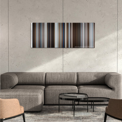 Fargo color palette canvas on a concrete wall above a gray sectional sofa