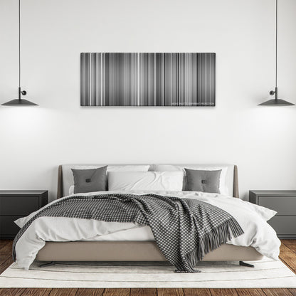 M color palette canvas above a bed, between two black pendant lamps