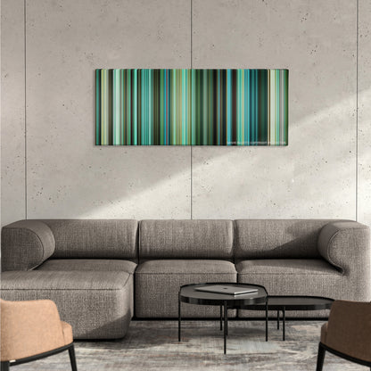 Venom color palette canvas on a concrete wall above a gray sectional sofa