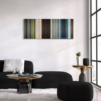 Jumanji: The Next Level color palette canvas above a black sofa with a gold-topped table