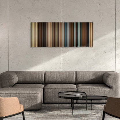 The Hunt color palette canvas on a concrete wall above a gray sectional sofa