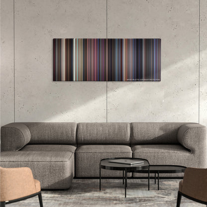 Boogie Nights color palette canvas on a concrete wall above a gray sectional sofa
