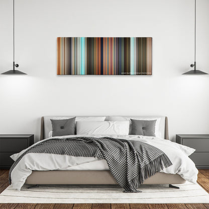Robots color palette canvas above a bed, between two black pendant lamps