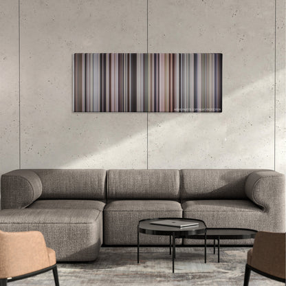 Awakenings color palette canvas on a concrete wall above a gray sectional sofa