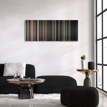 Orphan color palette canvas above a black sofa with a gold-topped table