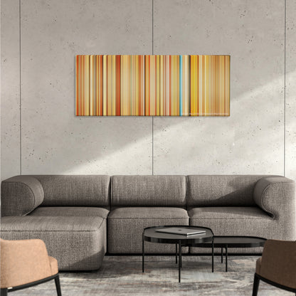 The Royal Tenenbaums color palette canvas on a concrete wall above a gray sectional sofa