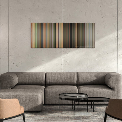 Hairspray color palette canvas on a concrete wall above a gray sectional sofa