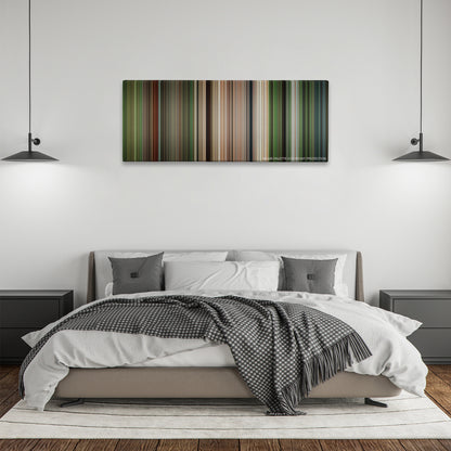 Apocalypto color palette canvas above a bed, between two black pendant lamps