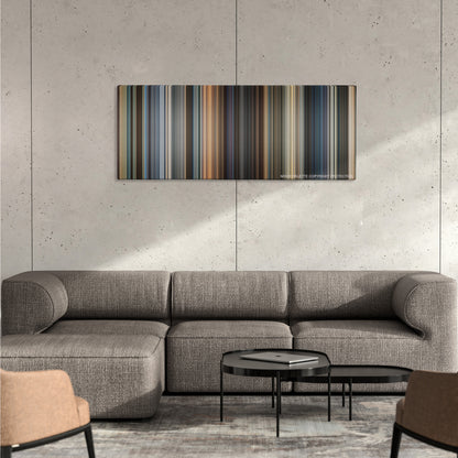 Now You See Me color palette canvas on a concrete wall above a gray sectional sofa