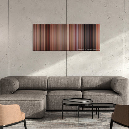 Freaky Friday color palette canvas on a concrete wall above a gray sectional sofa