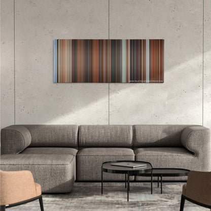 Mr. Deeds color palette canvas on a concrete wall above a gray sectional sofa