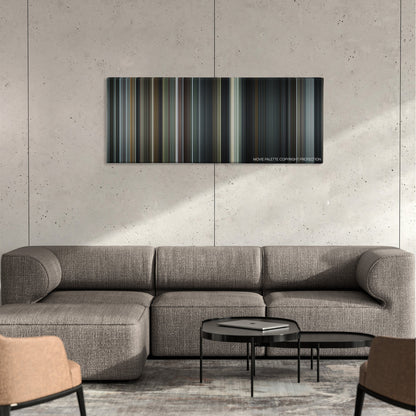 Capote color palette canvas on a concrete wall above a gray sectional sofa