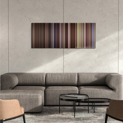 P.S. I Love You color palette canvas on a concrete wall above a gray sectional sofa