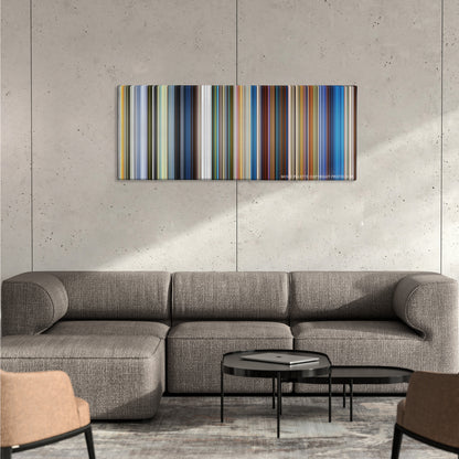 Klaus color palette canvas on a concrete wall above a gray sectional sofa