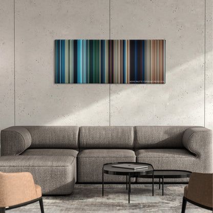 10,000 BC color palette canvas on a concrete wall above a gray sectional sofa