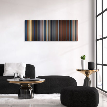Deep Blue Sea color palette canvas above a black sofa with a gold-topped table