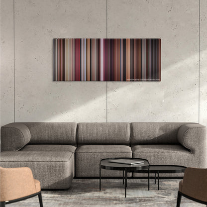 Scarface color palette canvas on a concrete wall above a gray sectional sofa