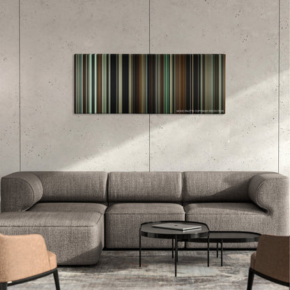 The Monuments Men color palette canvas on a concrete wall above a gray sectional sofa