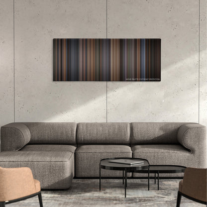 The Hours color palette canvas on a concrete wall above a gray sectional sofa