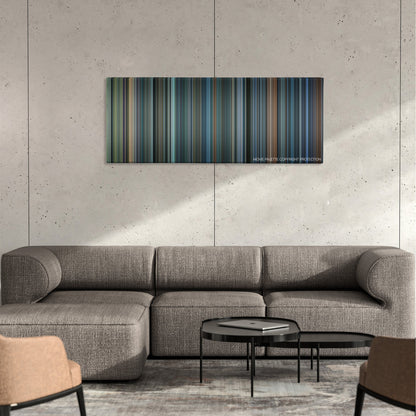 John Q color palette canvas on a concrete wall above a gray sectional sofa