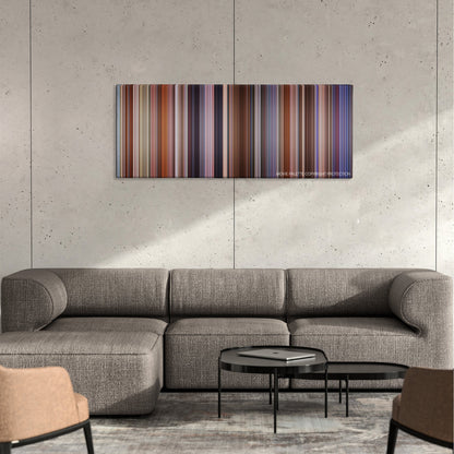 The Campaign color palette canvas on a concrete wall above a gray sectional sofa