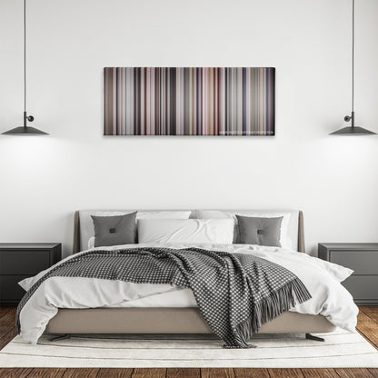 Awakenings color palette canvas above a bed, between two black pendant lamps