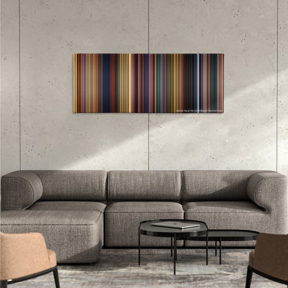 The Prince of Egypt color palette canvas on a concrete wall above a gray sectional sofa