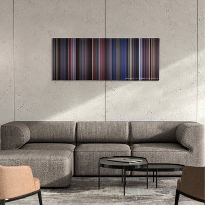 Man on the Moon color palette canvas on a concrete wall above a gray sectional sofa